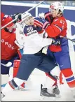  ??  ?? Anders Lee of USA (left), fights with Norway’s Alexander Bonsaksen (right), during the Hockey World Championsh­ips Group B match in Ostrava, Czech Republic on
May 2. (AP)