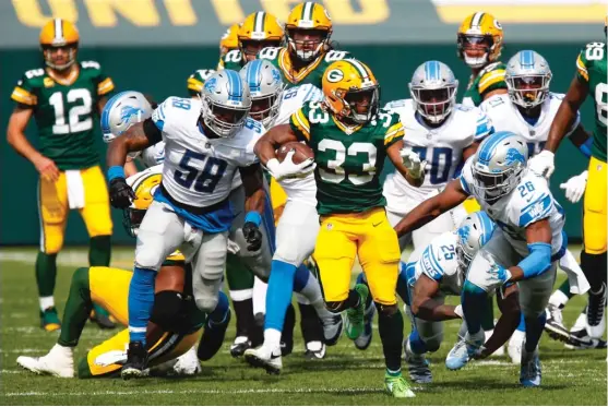  ?? MATT LUDTKE/AP ?? Packers running back Aaron Jones scored three touchdowns, including a 75-yard breakaway, against the Lions at Lambeau Field on Sunday.