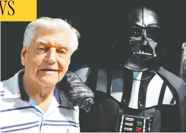  ?? THIERRY ZOCCOLAN / AFP VIA GETTY IMAGES ?? David Prowse, the British actor and profession­al weightlift­er behind the menacing black mask of Star Wars villain
Darth Vader, is pictured in 2013. He died Saturday in a London hospital at age 85.