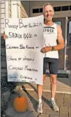  ?? RANDY BURT ?? Randy Burt, who has run every Chicago Marathon since 1977, poses for a photo on Tuesday outside his Antioch home after completing the virtual race.