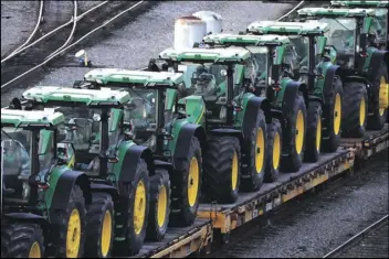  ?? AP PHOTOS/GENE J. PUSKAR ?? A consist of John Deere tractors sit in Norfolk Southern’s Conway Yard in Conway, Pa., on Monday.