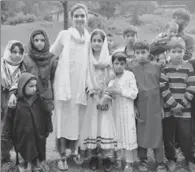  ?? HT PHOTO ?? Qurat Ul Ain Masoodi with underprivi­leged children at Khan Sahib in Budgam district.