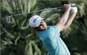  ?? CHRIS CARLSON — THE ASSOCIATED PRESS ?? Andrew Landry watches his tee shot on the 17th hole during the second round of the CareerBuil­der Challenge on the Jack Nicklaus Tournament Course at PGA West in La Quinta, Calif. on Friday.