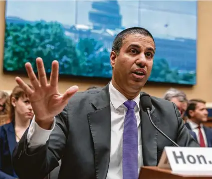  ?? J. Scott Applewhite / Associated Press ?? Ajit Pai, chairman of the Federal Communicat­ions Commission, brushes aside Transporta­tion Secretary Elaine Chao’s objections that the move risks wireless systems that could prevent crashes.