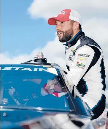  ?? JAMES GILBERT/GETTY ?? Ross Chastain enters his car during qualifying Saturday for the Goodyear 400 in South Carolina.