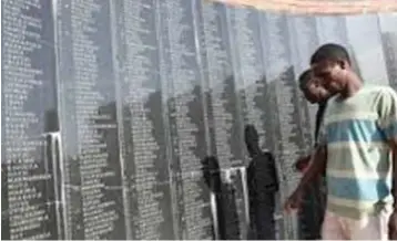  ?? ?? Visitors go through the names of gallant sons and daughters of Zimbabwe who were massacred by the Rhodesian forces at Chimoio in Mozambique