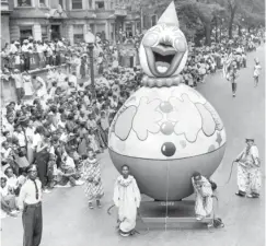  ??  ?? ABOVE: The Bud Billiken Parade winds through the South Side on Aug. 8, 1953, in this photo by Chicago Sun-Times photojourn­alist Carmen Reporto.