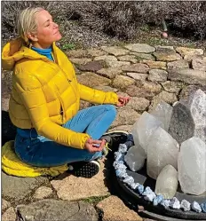  ??  ?? A MOMENT OF ZEN: Reality star Yolanda Hadid, one of the Real Housewives Of Beverly Hills, meditates with her crystals