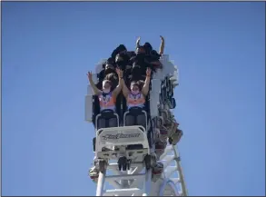  ?? (Bloomberg (WPNS)/Eric Thayer) ?? Visitors wearing masks ride on the ‘Full Throttle’ roller coaster at the Six Flags Magic Mountain theme park in Valencia, Calif., earlier this month.