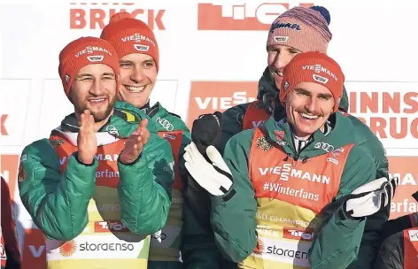  ?? FOTO: DPA ?? Gute Laune hochvier bei den Skispringe­rn (v.l.): Markus Eisenbichl­er (v.l.), Stephan Leyhe, Karl Geiger und Richard Freitag jubeln über Gold.