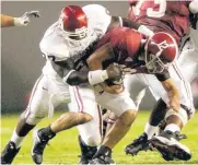  ?? [OKLAHOMAN ARCHIVES] ?? Oklahoma’s Tommie Harris sacks Alabama’s Brodie Croyle during the Sooners’ 20-13 win in 2003.