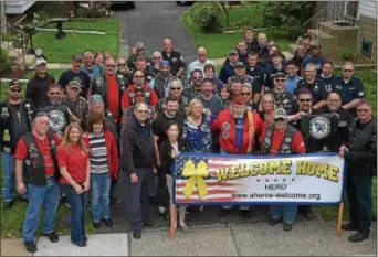  ?? PETE BANNAN — DIGITAL FIRST MEDIA ?? Vietnam veteran Joe Tier, military support organizati­ons A Hero’s Welcome and Warriors’ Watch and local fire companies pose for a group photo.