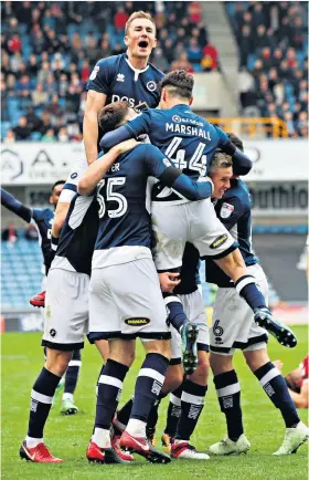  ??  ?? Main men: Steve Morison (below right) and his manager Neil Harris have inspired a resurgence that has left Millwall staring at a place in the top flight