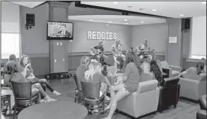  ?? Submitted photo ?? SPACE FOR REDDIES: A $200,000 renovation to the Reddie Café at Henderson State University includes a stage and sound system for live events. The redesign took the shape of a modern coffee house as a comfortabl­e and inviting space.