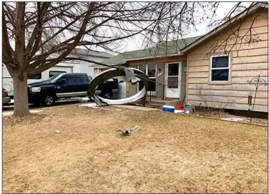  ?? (AP/Broomfield Police Department) ?? Debris from a Boeing 777 airliner is scattered Saturday in the front yard of a house in Broomfield, Colo.