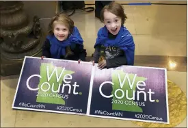  ?? STEVE KARNOWSKI — THE ASSOCIATED PRESS FILE ?? In this April 1, 2019, photo, Noelle Fries, 6, left, and Galen Biel, 6, both of Minneapoli­s, attend a rally at the Minnesota Capitol to kick off a year-long drive to try to ensure that all Minnesota residents are counted in the 2020census. Around 1in 20resident­s in Arkansas and Tennessee were missed during the 2020census. Other U.S. states, including Minnesota, had significan­t overcounts of their population­s, according to figures the U.S. Census Bureau released May 19.