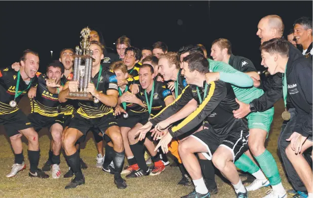  ?? Picture: ANNA ROGERS ?? HIGH SPIRITS: Edge Hill United players with the premiershi­p trophy after their 1-1 draw with Southside Comets last Saturday night.