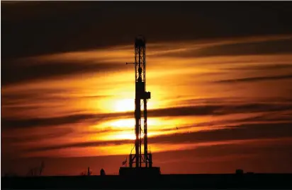  ?? SUE OGROCKI — THE ASSOCIATED PRESS FILE ?? An oil rig is pictured at sunset in El Reno, Okla. The Biden Administra­tion announced it is canceling three oil and gas lease in the Gulf of Mexico and off the coast of Alaska.