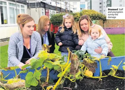  ??  ?? Stunned Staff and youngsters survey the damage