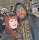  ?? PROVIDED BY CHELSEA BANNING ?? Ohio author Chelsea Banning smiles beside David Jackson, who attended the Jan. 28 signing event in Ashtabula, Ohio, as Sir Jabir from Banning’s book, “Of Crowns and Legends.”