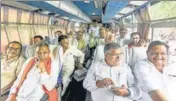  ?? PTI ?? BJP MLAs on board a bus heading to the resort on Monday.