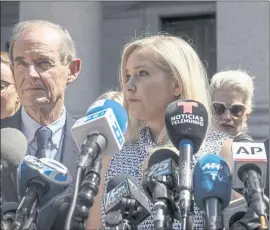  ?? BEBETO MATTHEWS — THE ASSOCIATED PRESS ?? Virginia Giuffre, center, who says she was trafficked by sex offender Jeffrey Epstein, holds a news conference outside a Manhattan court in New York in April 2019.