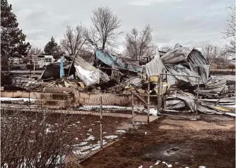  ?? Ty O'neil/associated Press ?? Snow covers a home that was destroyed by the Smokehouse Creek fire Feb. 29 in Stinnett. Texans without insurance face a steep — if not impossible — path to restore their finances.