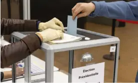  ?? Photograph: Salvatore Di Nolfi/EPA ?? A voter casts a ballot for the 2022 French presidenti­al election.