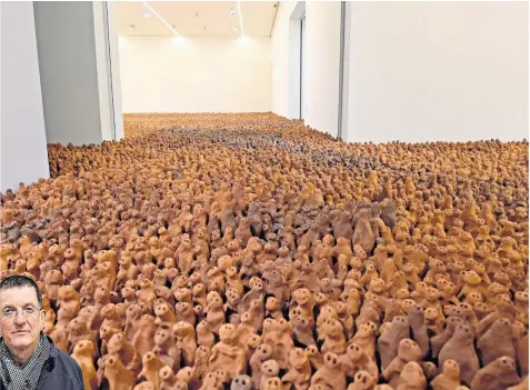  ??  ?? The artwork by Sir Antony Gormley, left, features 40,000 tiny figures