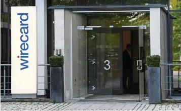  ?? — AFP ?? Scandal hit: The entrance to the headquarte­rs of fintech company Wirecard in Aschheim,
€1.9bil southern Germany. Wirecard admitted that auditors say are missing from its accounts likely ‘did not exist’, fuelling fraud suspicions that saw its CEO resign.