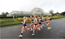  ?? Photograph: Tom Dulat/British Athletics/Getty Images ?? Stephanie Davis, wearing No 52, settles into the leading pack in front of the Palm House at Kew Gardens on Friday.