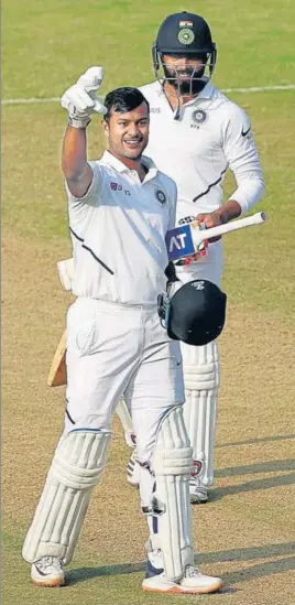  ?? ANI ?? ■
Mayank Agarwal gestures towards the India dressing room after reaching his double century on the second day of the first Test against Bangladesh in Indore on Friday.