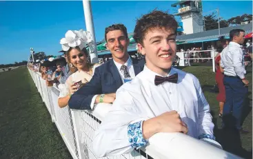  ??  ?? TRACK SIDE: Taylor Blue, Josh Veale and Tennyson Boag take up their prime viewing positions.