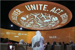  ?? (AP/Peter Dejong) ?? Delegates arrive for a meeting at the COP28 U.N. Climate Summit on Sunday in Dubai, United Arab Emirates.