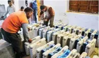  ?? - PTI ?? GEARING UP: Electronic Voting Machines being arranged to be distribute­d to polling officers on the eve of fourth phase of Uttar Pradesh polling in Allahabad on Wednesday.