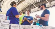  ?? Photo by Alex Ostasiewic­z/Americares ?? Americares relief workers start get organized in Nassau on Saturday.