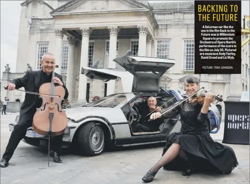  ??  ?? A DeLorean car like the one in the film Back to the Future was in Millennium Square to promote the Orchestra of Opera North’s performanc­e of the score to the film on July 30. Pictured are musicians Andy Fairley, David Greed and Liz Wyly.
