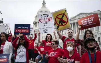  ?? Jabin Botsford/The Washington Post ?? Protesters call for action on gun control as Senate Democrats speak last month on Capitol Hill in Washington.