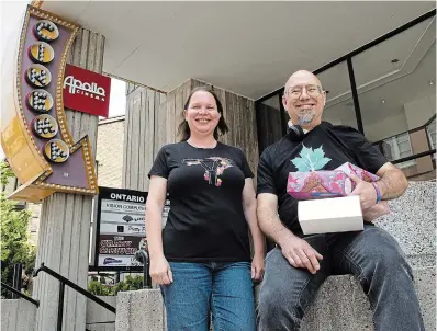  ?? MATHEW MCCARTHY WATERLOO REGION RECORD ?? Karen Farley of Period Pin, left, and Kevin Hiebert of Changing The Flow stand in front of the Apollo Cinema, where an event is planned for Menstrual Health Day on May 28.