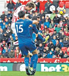  ??  ?? Aerial assault: Peter Crouch outjumps the Leicester defence to equalise for Stoke