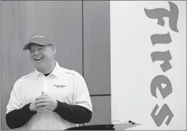  ?? [MIKE CARDEW/AKRON BEACON JOURNAL] ?? Two-time Indy 500 winner Al Unser Jr. laughs as he talks about Firestone racing tires during the Wednesday announceme­nt about a new Akron tire plant.