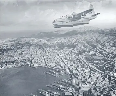 ?? Photo: ALEXANDER TURNBULL LIBRARY ?? Air service: A Teal Solent flying boat over Wellington on the first internatio­nal air service out of the capital.