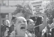  ?? RICH PEDRONCELL­I — THE ASSOCIATED PRESS ?? Allegra Taylor, left, and other protestors gather outside Sacramento City Hall to condemn the shooting of Stephon Clark by Sacramento police officers.