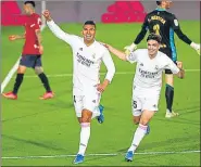  ?? REUTERS ?? Real Madrid's Casemiro (L) and Miguel Ortega Gutierrez after their second goal against Osasuna.