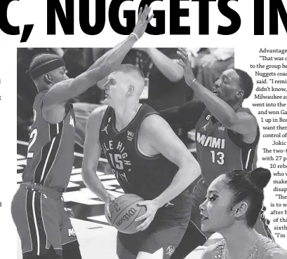  ?? ?? MIAMI’S Jimmy Butler (left) and Bam Adebayo (right) double team on Denver’s Nikola Jokic. AP