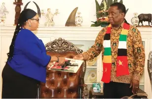  ?? Picture: Kudakwashe Hunda ?? President Mnangagwa hands over the Delimitati­on Report to Zimbabwe Electoral Commission chairperso­n Justice Priscilla Chigumba (left) at State House in Harare yesterday.–