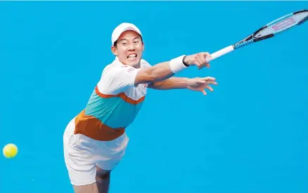  ?? EPA-Yonhap ?? Kei Nishikori of Japan in action during his round two men's singles match against Ivo Karlovic of Croatia at the Australian Open Grand Slam tennis tournament in Melbourne, Australia, Thursday.