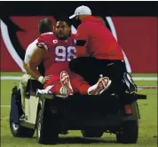  ?? RICK SCUTERI — THE ASSOCIATED PRESS ?? Cardinals defensive tackle Corey Peters (98) is carted off the field after an injury against the Bills on Sunday,