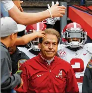  ?? KEVIN C. COX / GETTY IMAGES ?? It wasn’t quite business as usual last year for Nick Saban’s Tide, who got into the playoffs without winning their league — but still took the national title.