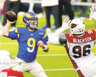  ?? ASHLEY LANDIS AP ?? John Wolford (9) helped the Rams earn a playoff berth with a win over the Cardinals on Sunday.